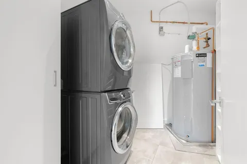 a view of a garden with buildings in the background