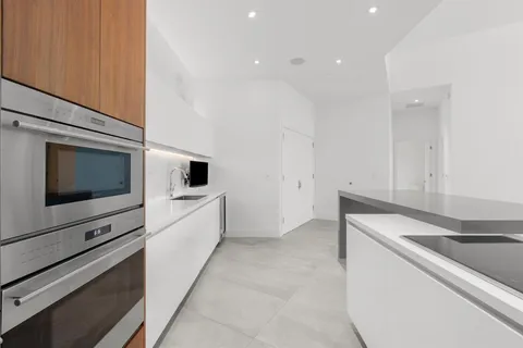 a view of kitchen with microwave and stove