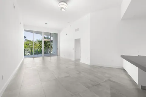 a view of dining room with furniture and window