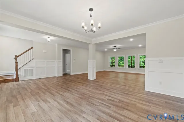 a living room with furniture or kitchen view and a wooden floor