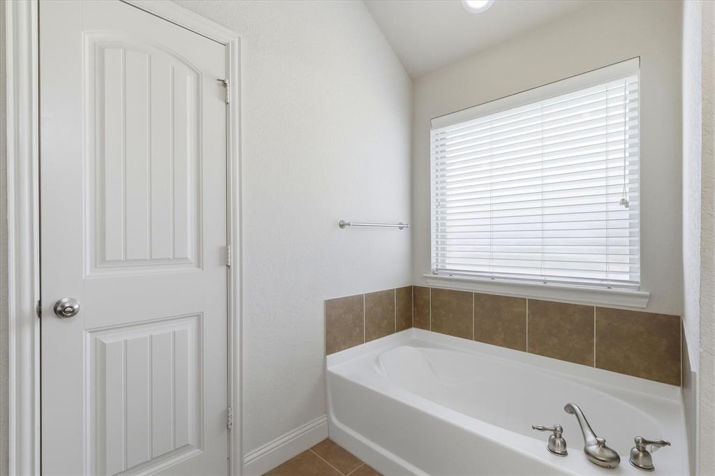 115 Blue Quail Road Red Oak, TX 75154 - Photo 15 of 35 White paneled door with chrome hardware