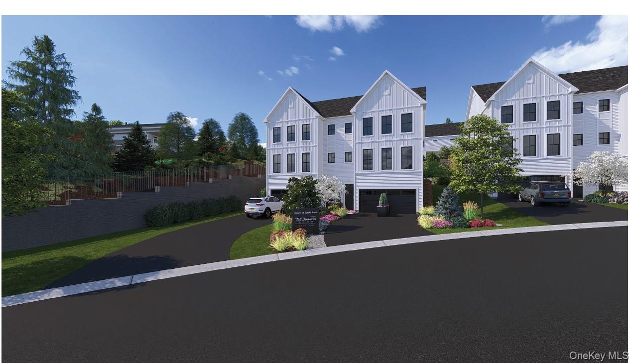 12 Victor Street, Unit 12 Yonkers, NY 10701 - Photo 1 of 3 View of front of home asphalt driveway, and an attached 2-car garage