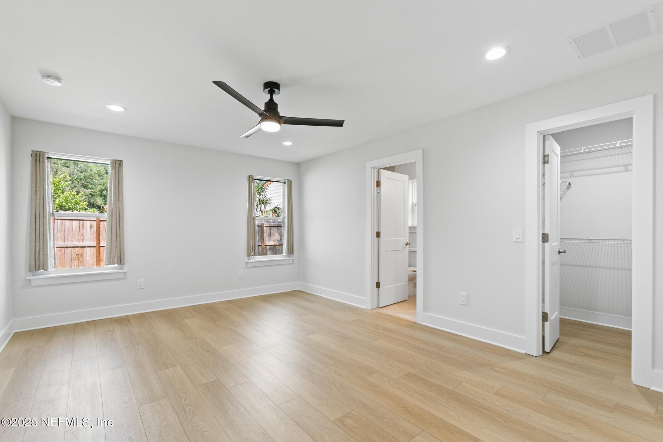 16 Sidney Street St. Augustine, FL 32084 - Photo 18 of 38 a view of an empty room with wooden floor and a window