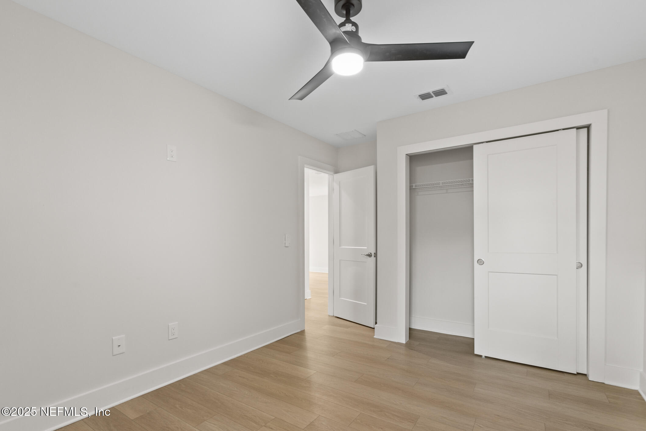 16 Sidney Street St. Augustine, FL 32084 - Photo 27 of 38 an empty room with wooden floor and windows