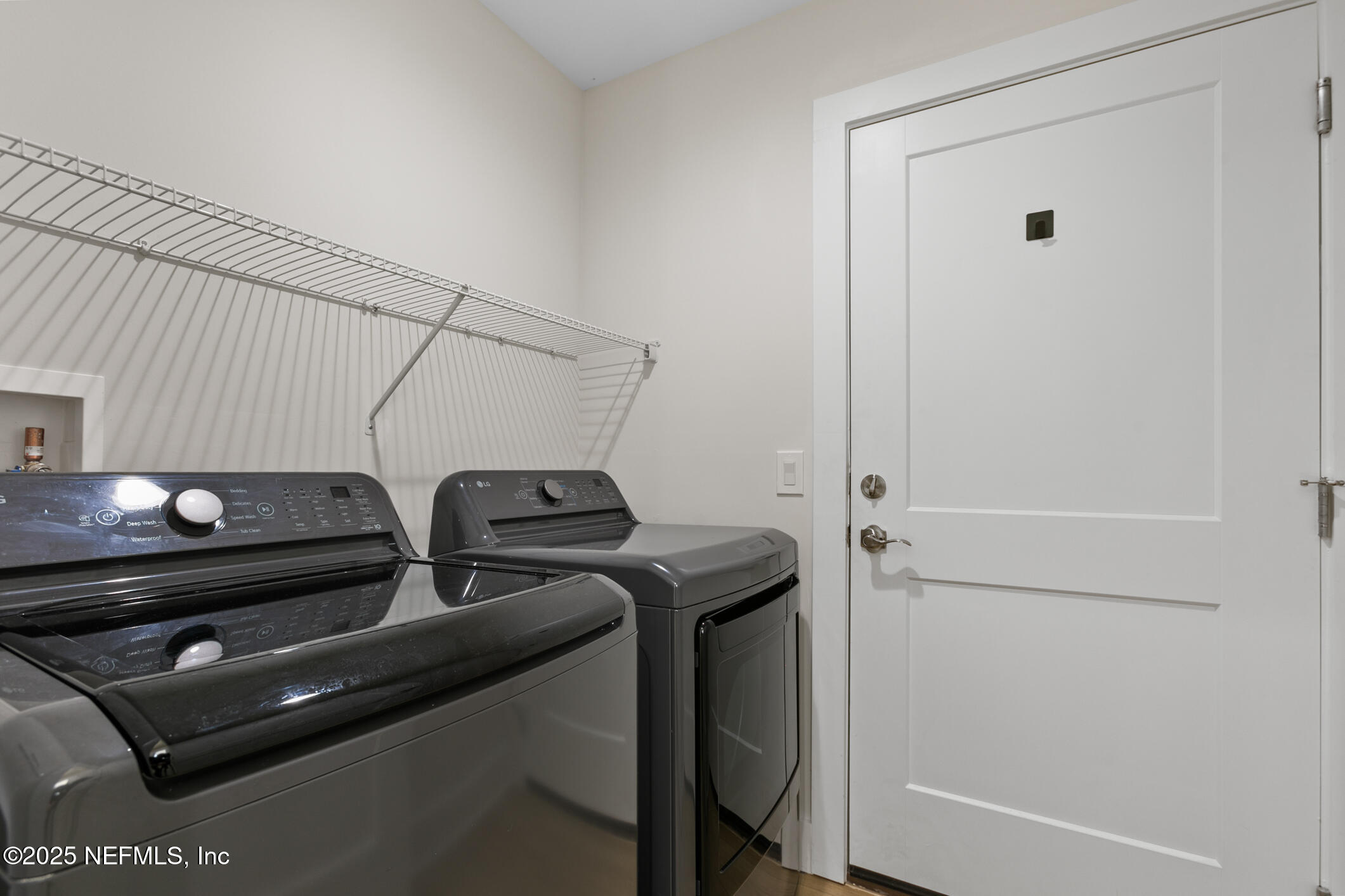 16 Sidney Street St. Augustine, FL 32084 - Photo 29 of 38 a view of storage and utility room with racks on the wall