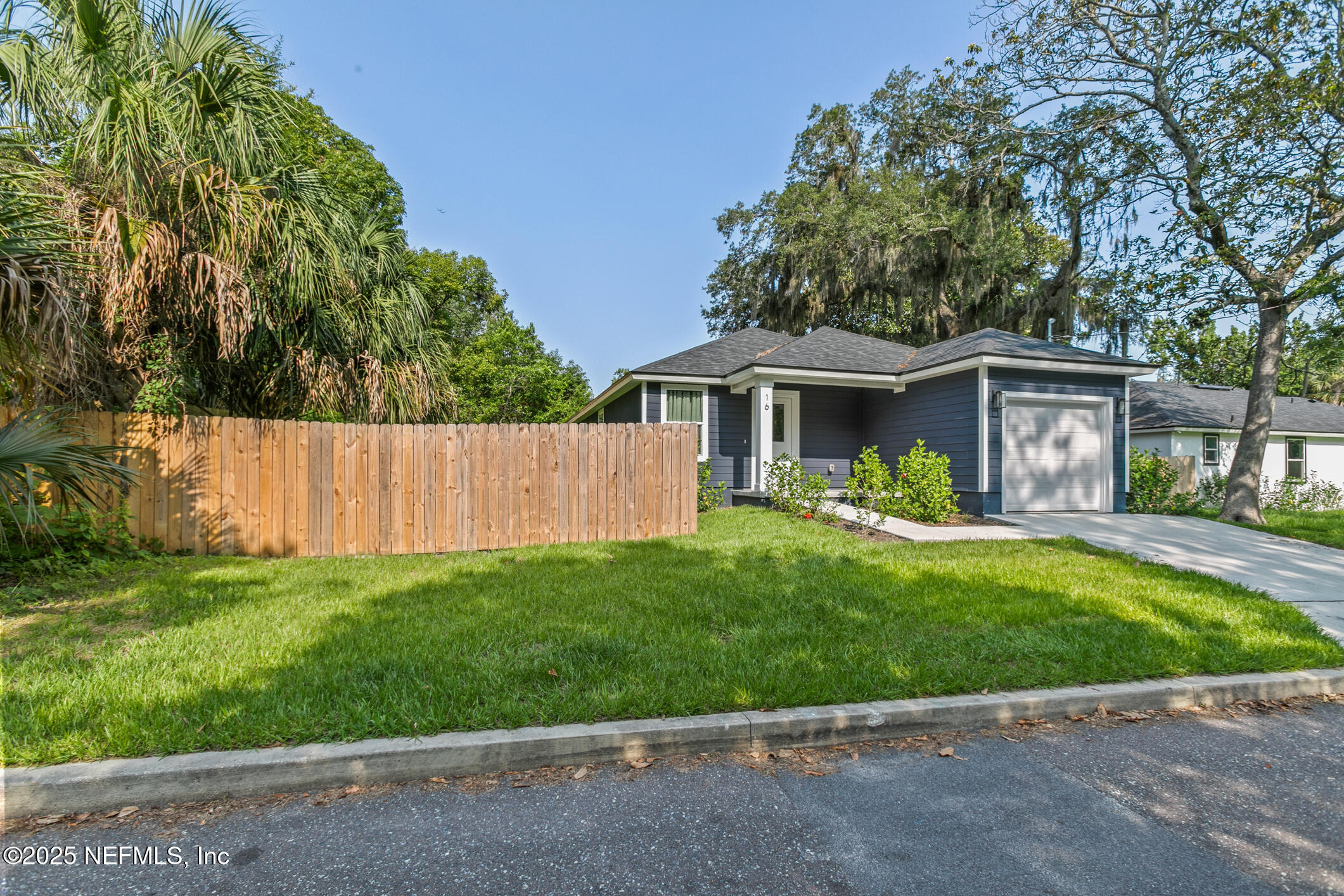 16 Sidney Street St. Augustine, FL 32084 - Photo 8 of 38 a view of a house with a yard and a garden