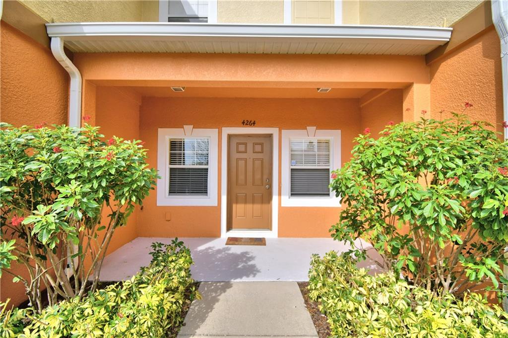 4264 Birch Pond Loop Lakeland, FL 33812 - Photo 1 of 1 a front view of a house with garden
