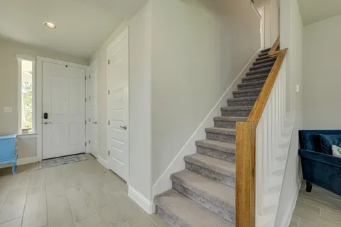 a bathroom with a sink mirror and toilet