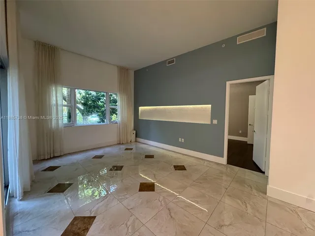 a view of room with a large window