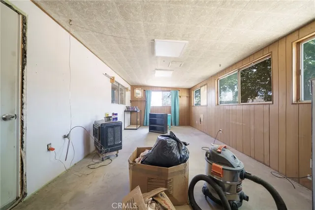 a bed room with furniture and a window