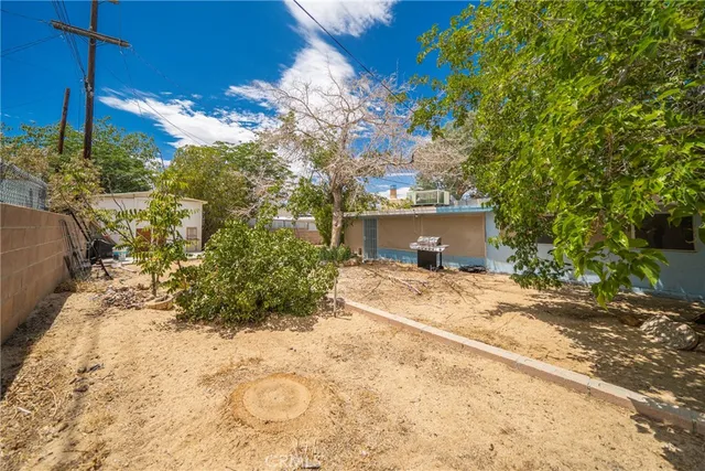 a view of a house with a snow in the yard