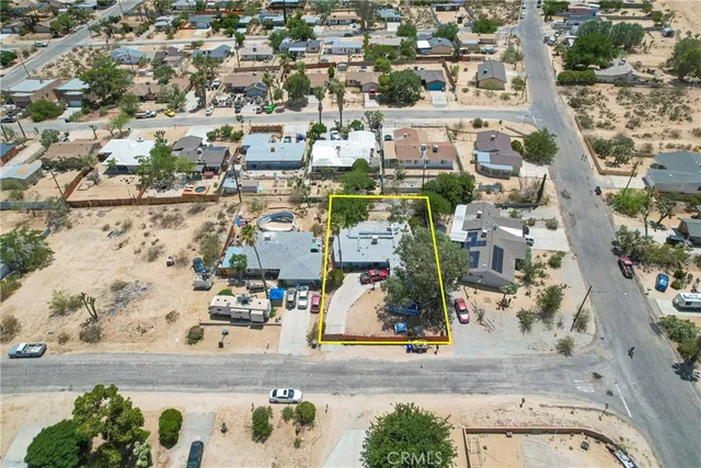 an aerial view of residential houses with outdoor space