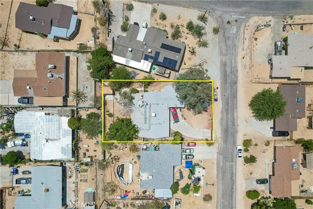 an aerial view of houses with outdoor space