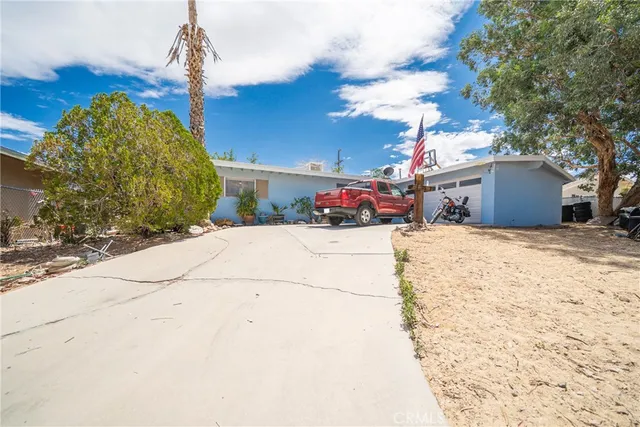a view of a house with a snow in the yard