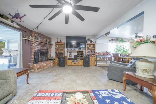 a living room with lots of furniture and kitchen view