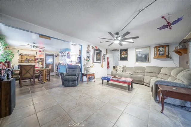 a living room with furniture and white walls