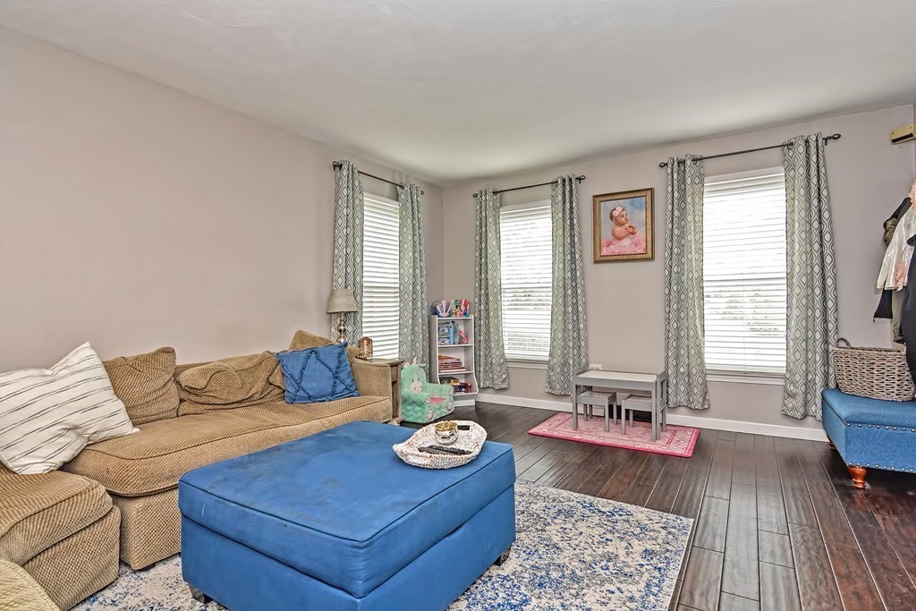 96 Danforth Street, Unit 19 Taunton, MA 02780 - Photo 11 of 31 a living room with furniture and wooden floor