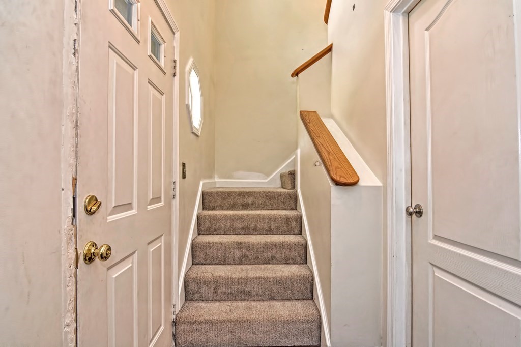 96 Danforth Street, Unit 19 Taunton, MA 02780 - Photo 15 of 31 a view of staircase with white walls and a window