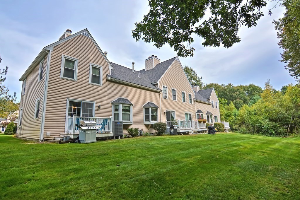 96 Danforth Street, Unit 19 Taunton, MA 02780 - Photo 25 of 31 a front view of house with yard and green space
