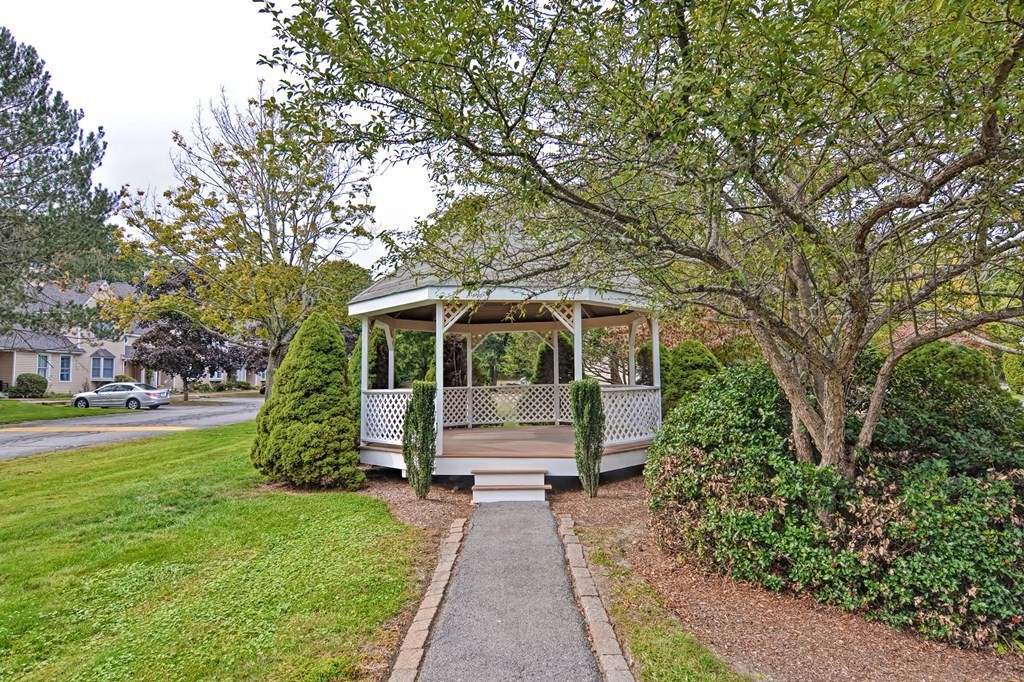 96 Danforth Street, Unit 19 Taunton, MA 02780 - Photo 4 of 31 a front view of a house with a yard