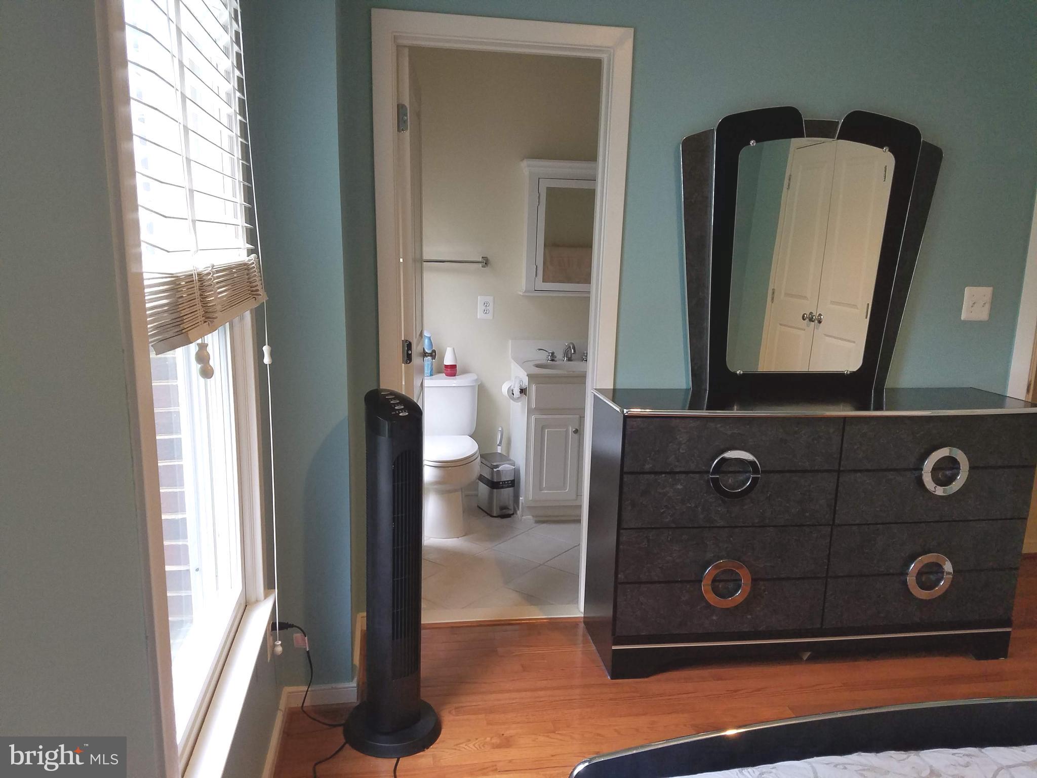 2338 Cobble Hill Terrace Silver Spring, MD 20902 - Photo 11 of 25 a bathroom with a double vanity sink and mirror