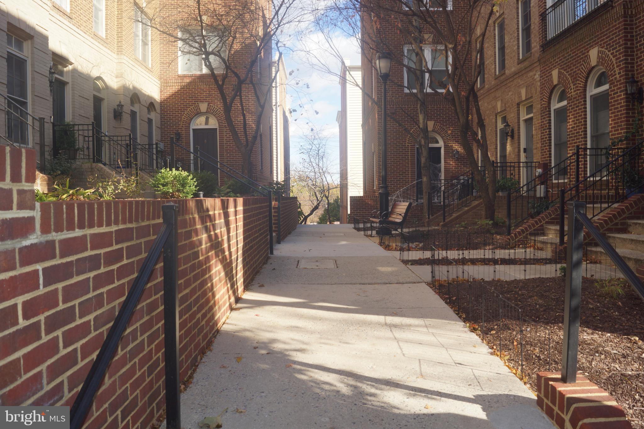 2338 Cobble Hill Terrace Silver Spring, MD 20902 - Photo 16 of 25 a view of a pathway with a bench