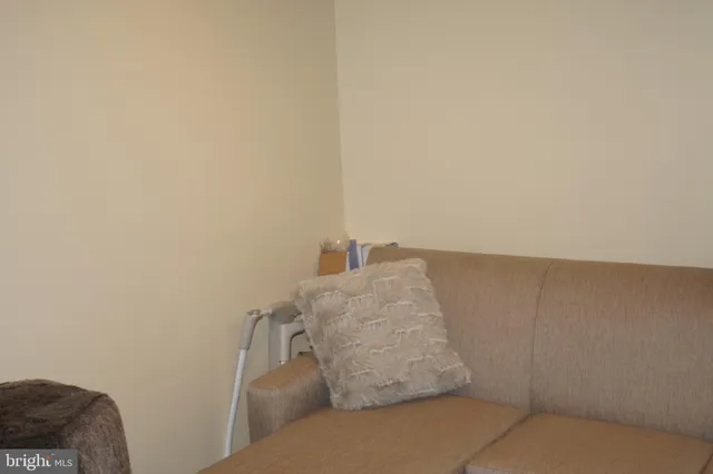 a bedroom with a bed and curtain