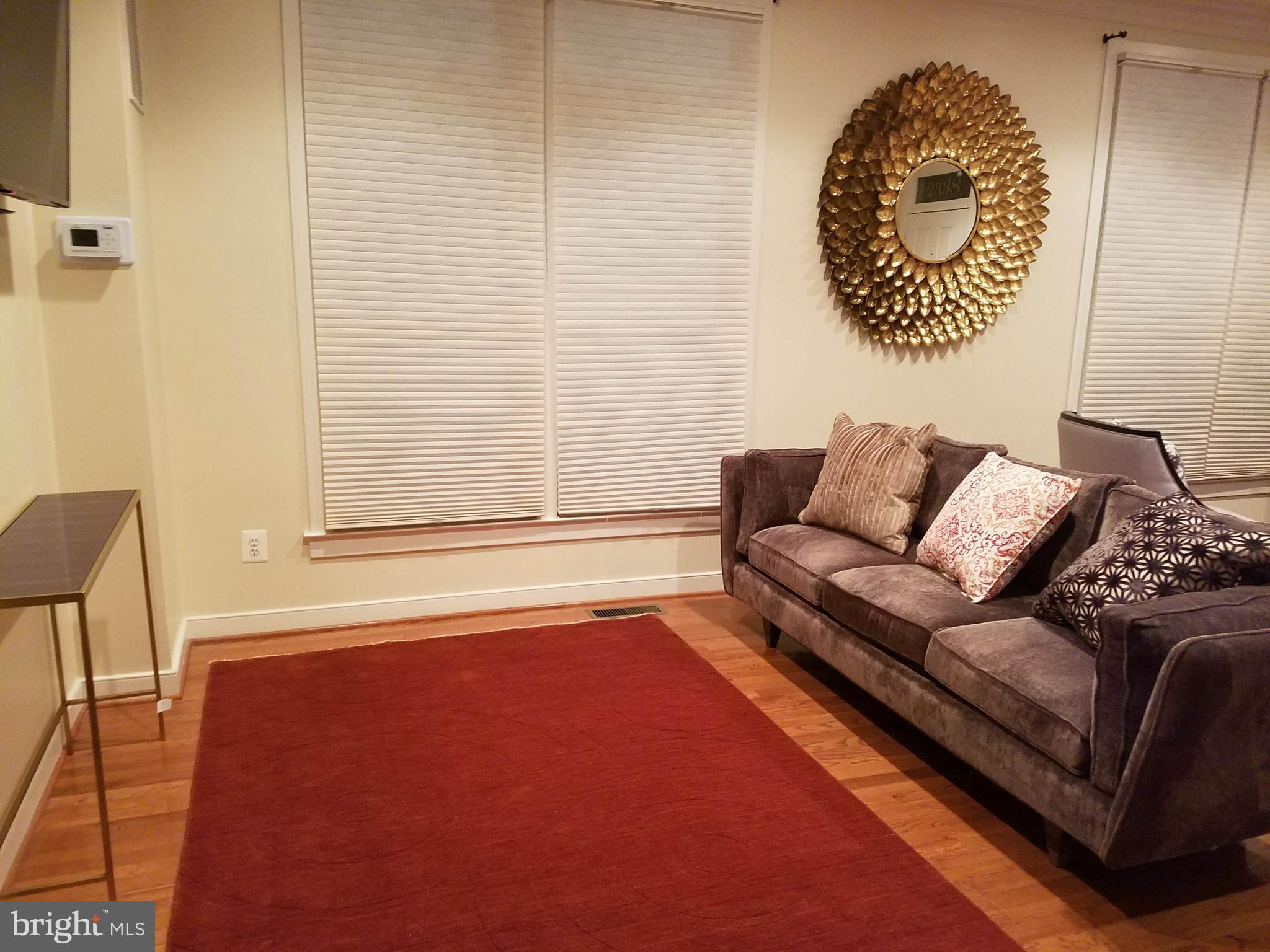 2338 Cobble Hill Terrace Silver Spring, MD 20902 - Photo 7 of 25 a living room with a couch and a table