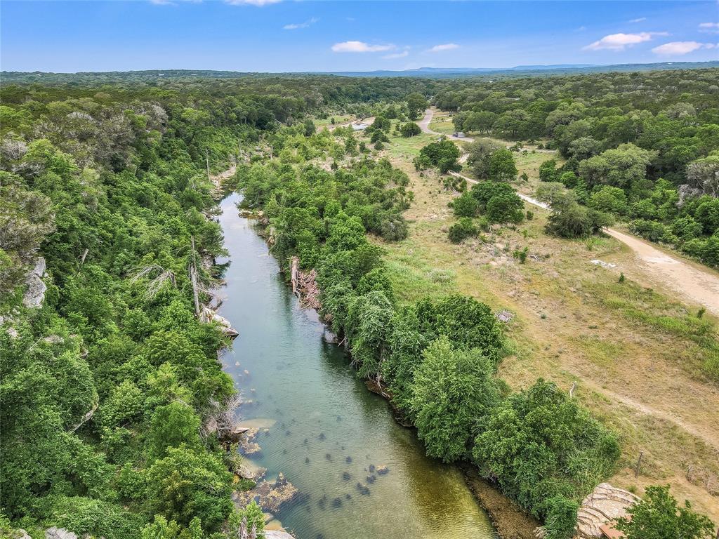 4401 Cottonwood Road Wimberley, TX 78676 - Photo 6 of 6 a view of a yard with a lake view