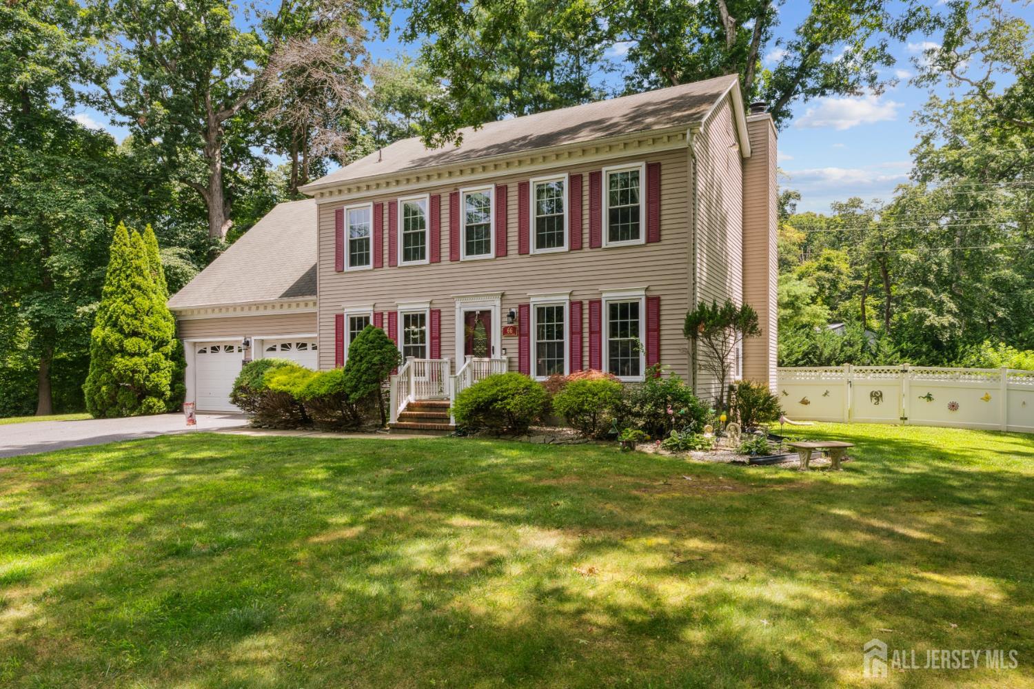 66 Spring Hill Road Old Bridge, NJ 07747 - Photo 11 of 32 a front view of a house with a yard