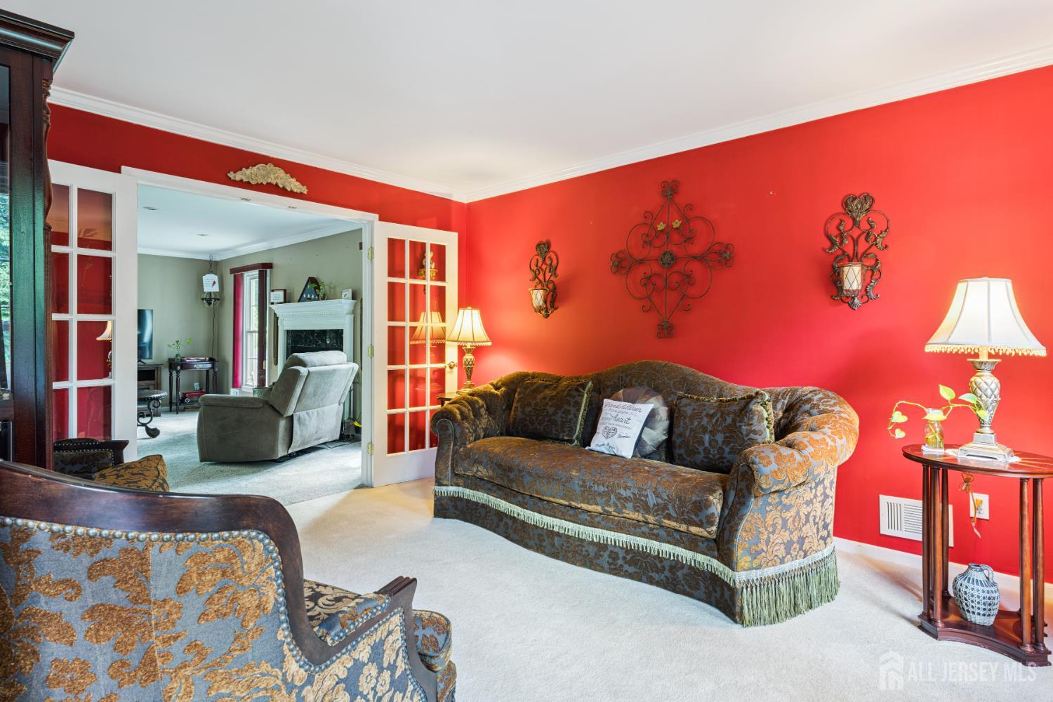66 Spring Hill Road Old Bridge, NJ 07747 - Photo 17 of 32 a living room with furniture a flat screen tv and a lamp
