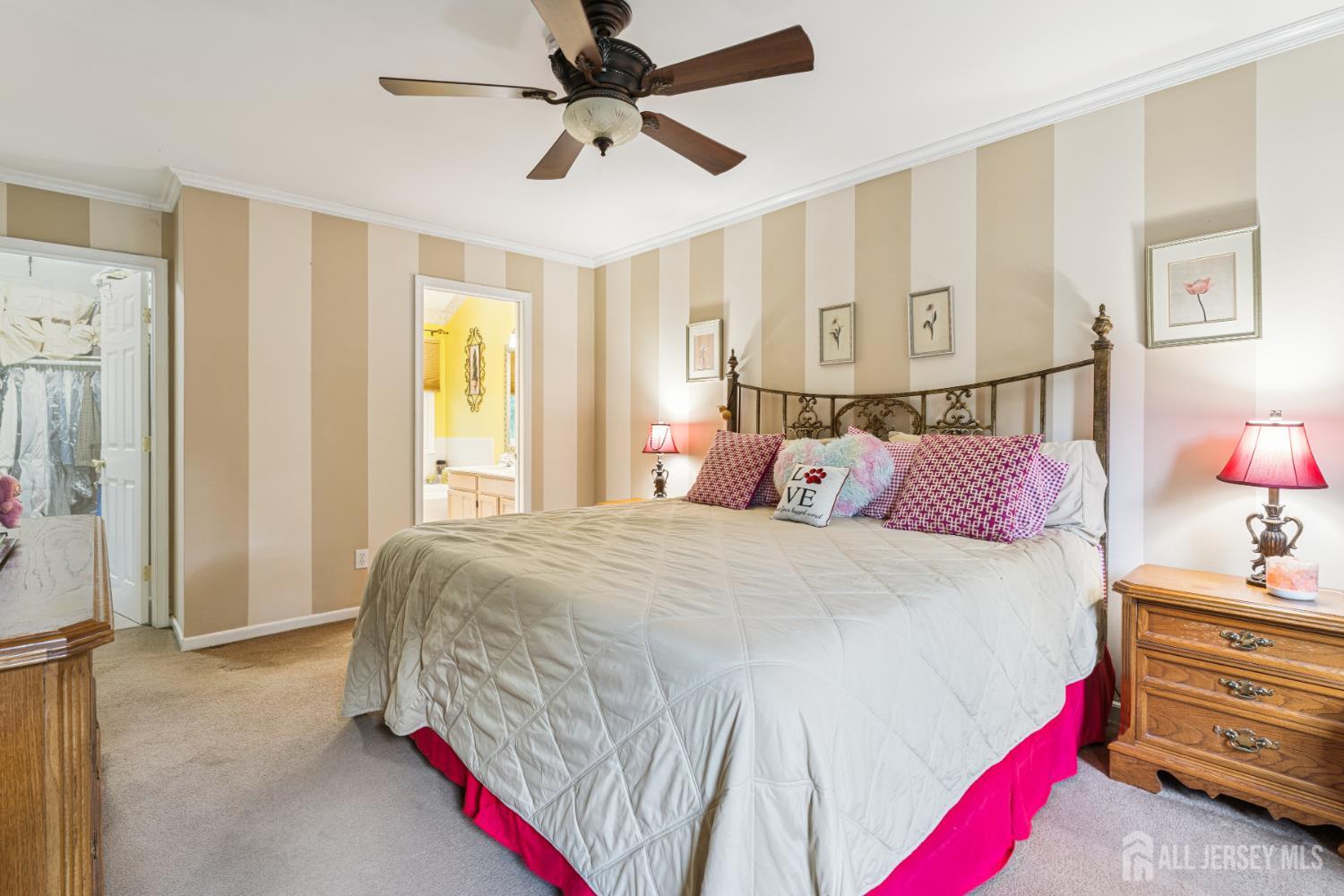 66 Spring Hill Road Old Bridge, NJ 07747 - Photo 22 of 32 a bedroom with a bed and a chandelier