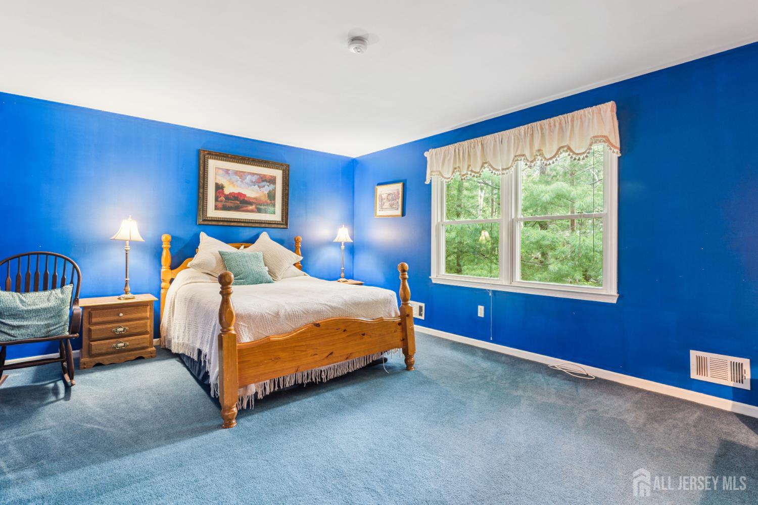 66 Spring Hill Road Old Bridge, NJ 07747 - Photo 24 of 32 a bedroom with a bed and a painting on the wall