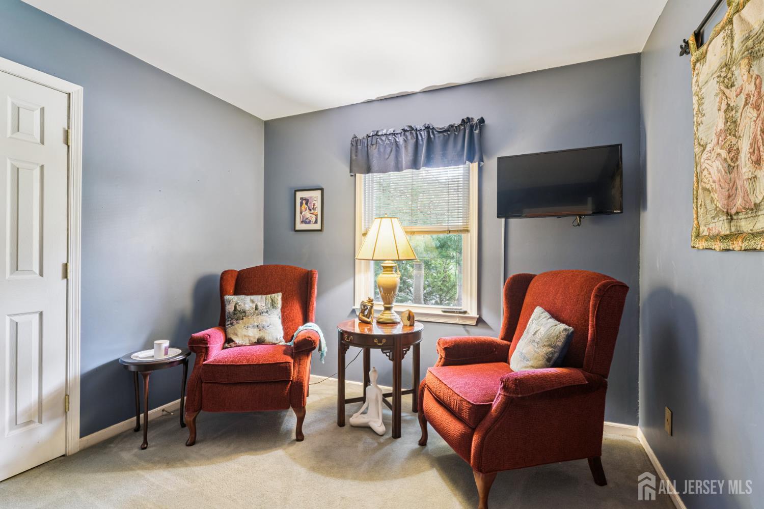 66 Spring Hill Road Old Bridge, NJ 07747 - Photo 27 of 32 a living room with furniture and a flat screen tv