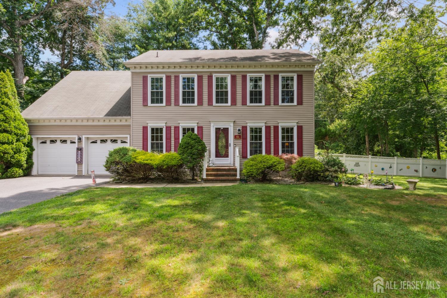 66 Spring Hill Road Old Bridge, NJ 07747 - Photo 9 of 32 a front view of a house with a yard