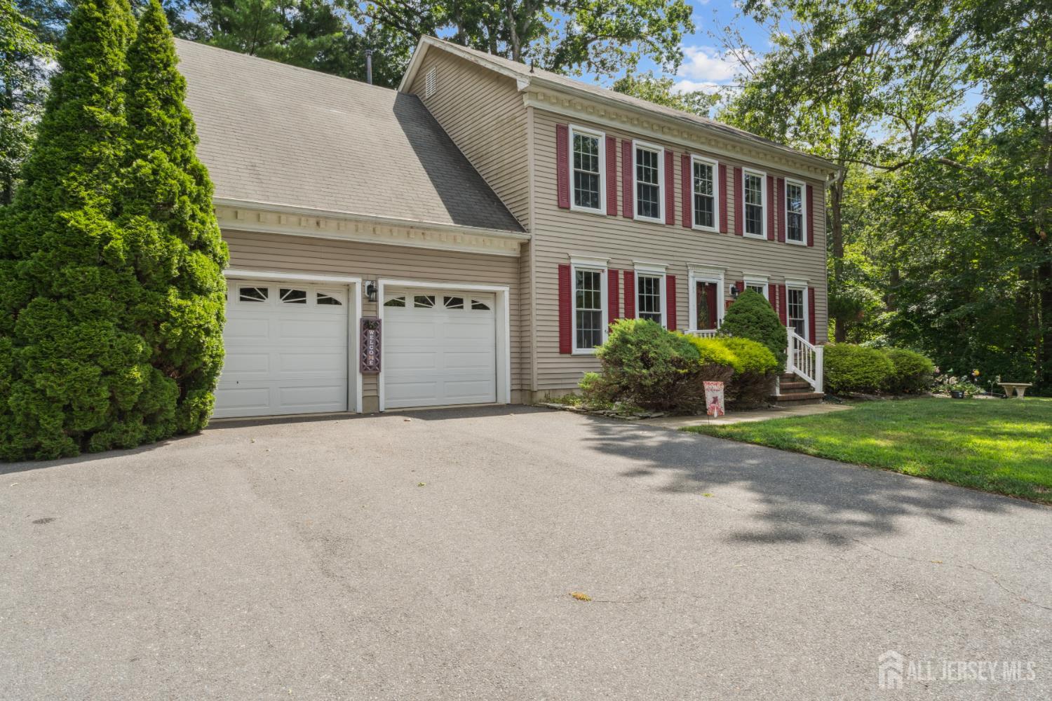 66 Spring Hill Road Old Bridge, NJ 07747 - Photo 10 of 32 a front view of a house with garden