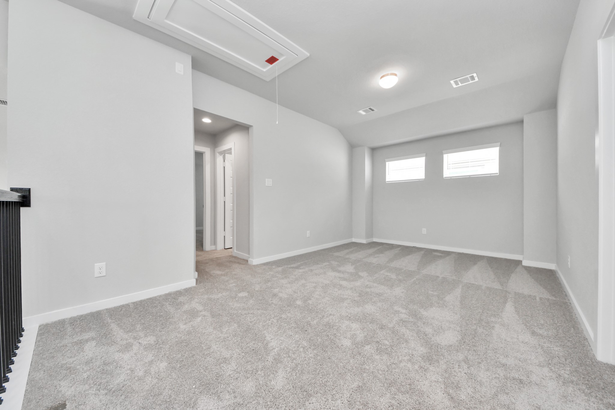 11114 Tulip Rdg Trail Houston, TX 77044 - Photo 23 of 30 Ascend to relaxation in this fantastic game room! Ideal for both casual gatherings and adult gaming, it boasts plush carpet, lofty ceilings, custom paint, and ample windows for abundant natural light. Sample photo of completed home with similar floor plan. Actual colors and selections may vary.