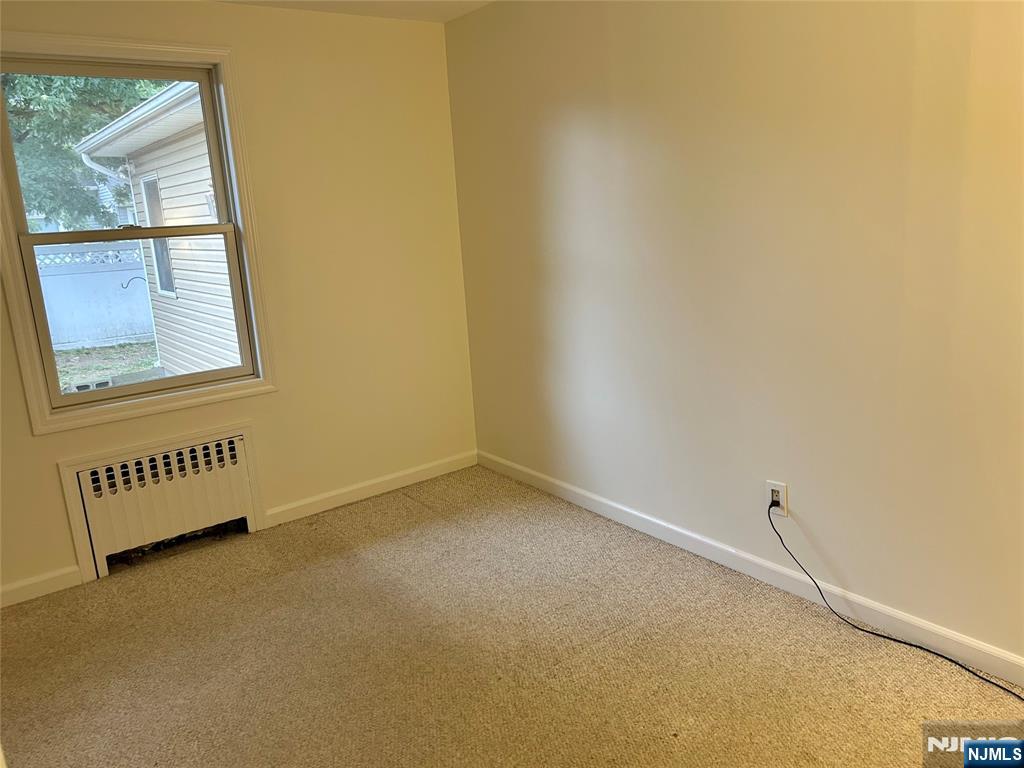 10-11 Alexander Avenue Fair Lawn, NJ 07410 - Photo 11 of 19 an empty room with windows