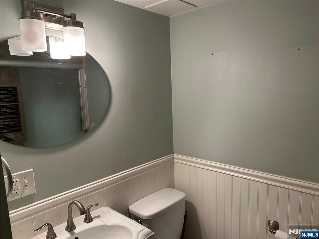 10-11 Alexander Avenue Fair Lawn, NJ 07410 - Photo 16 of 19 a bathroom with a sink and a mirror