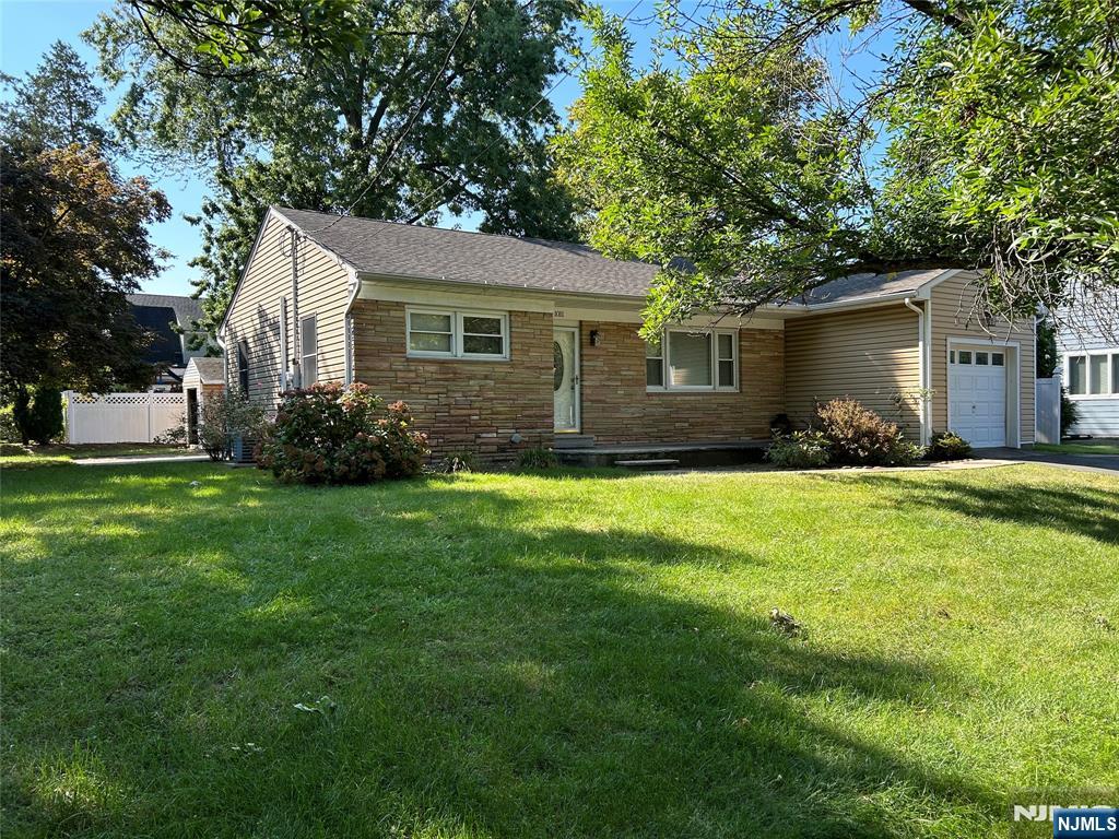 10-11 Alexander Avenue Fair Lawn, NJ 07410 - Photo 2 of 19 a front view of house with yard and green space