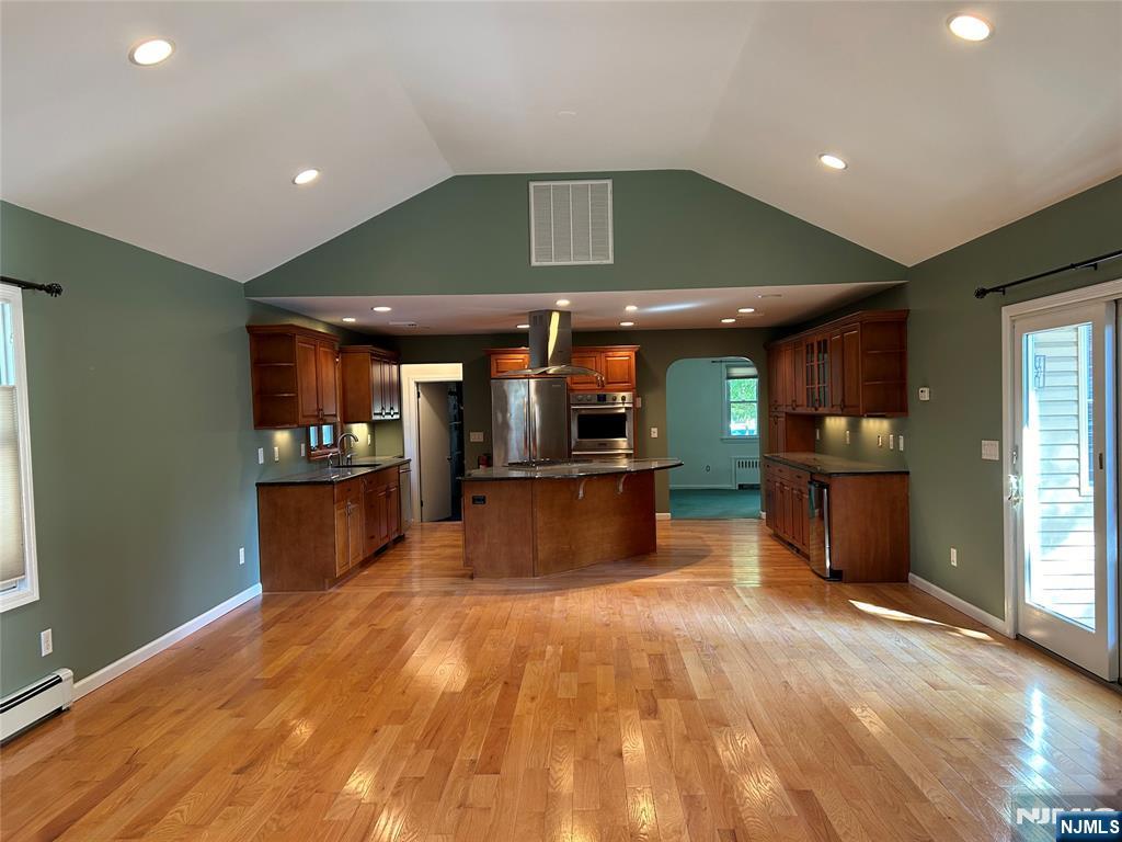 10-11 Alexander Avenue Fair Lawn, NJ 07410 - Photo 7 of 19 a large kitchen with stainless steel appliances kitchen island a large island in the center