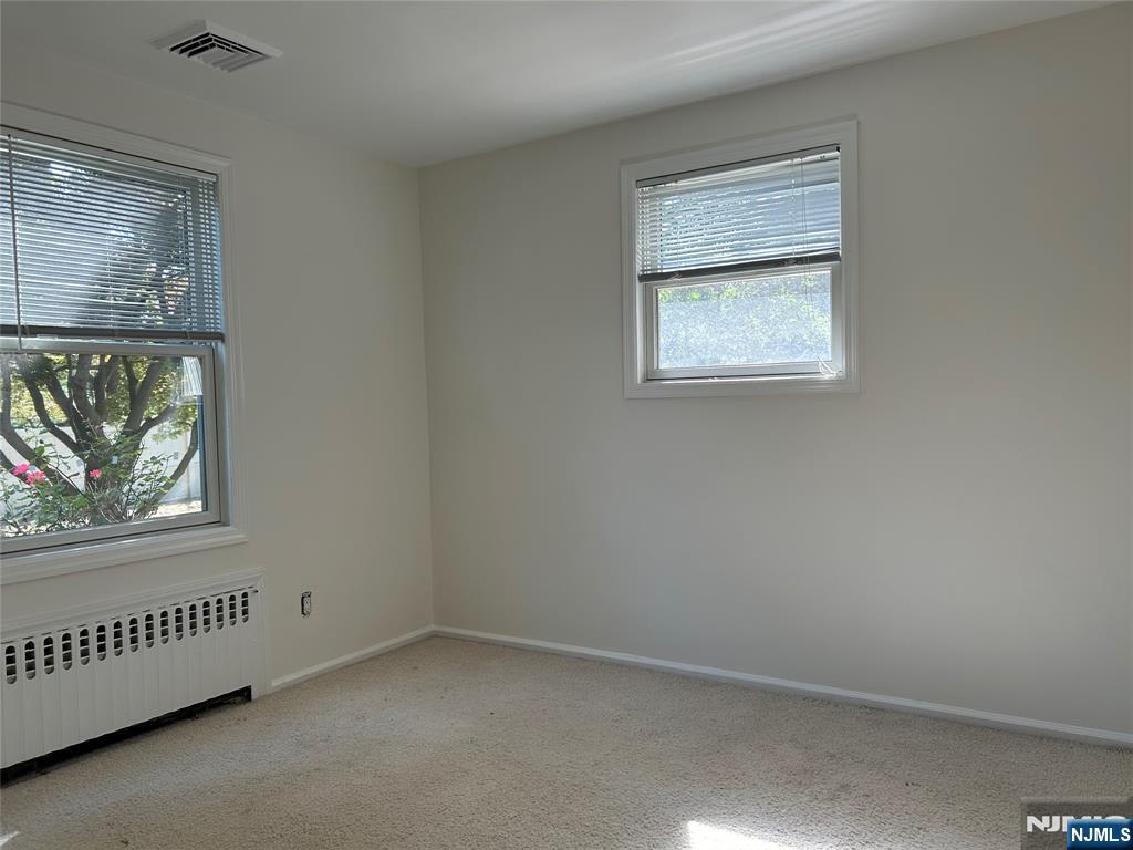 10-11 Alexander Avenue Fair Lawn, NJ 07410 - Photo 9 of 19 an empty room with windows