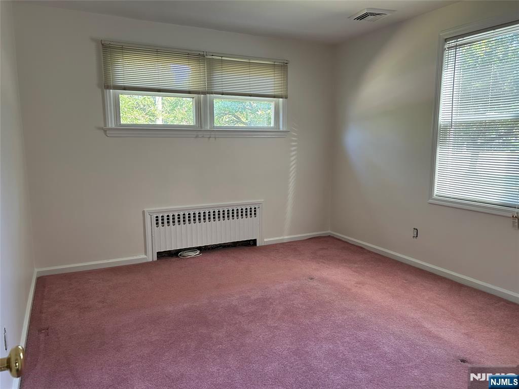 10-11 Alexander Avenue Fair Lawn, NJ 07410 - Photo 10 of 19 an empty room with a window
