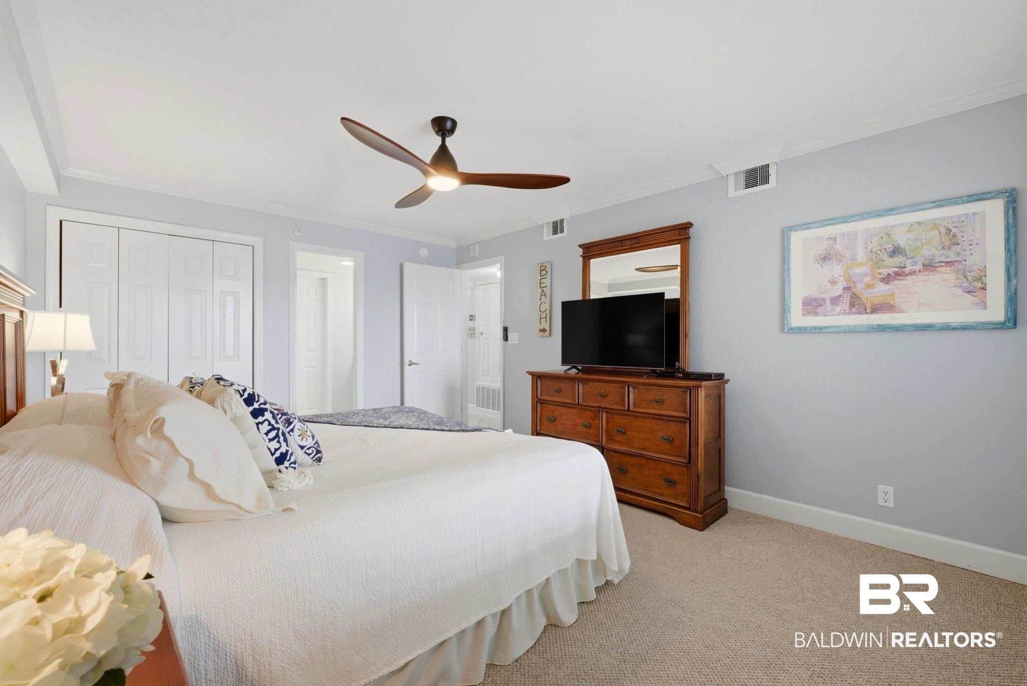 16284 Perdido Key Drive, Unit 912 Perdido Key, FL 32507 - Photo 32 of 49 Bedroom featuring a closet, ceiling fan, ornamental molding, and light colored carpet