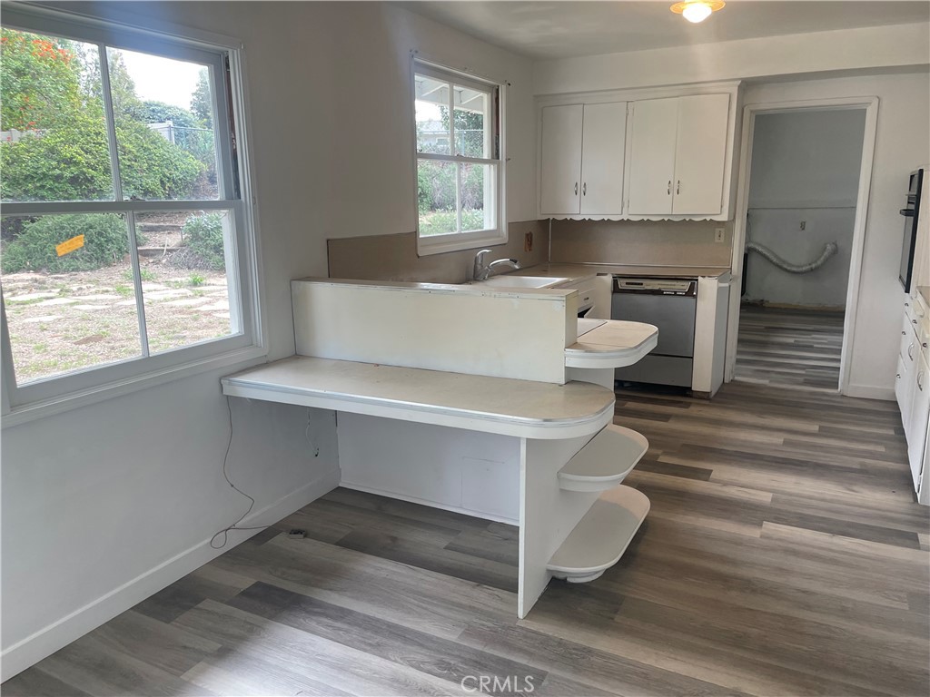 109 Miramonte Drive Fullerton, CA 92835 - Photo 6 of 13 a living room with a couches and large window with kitchen view