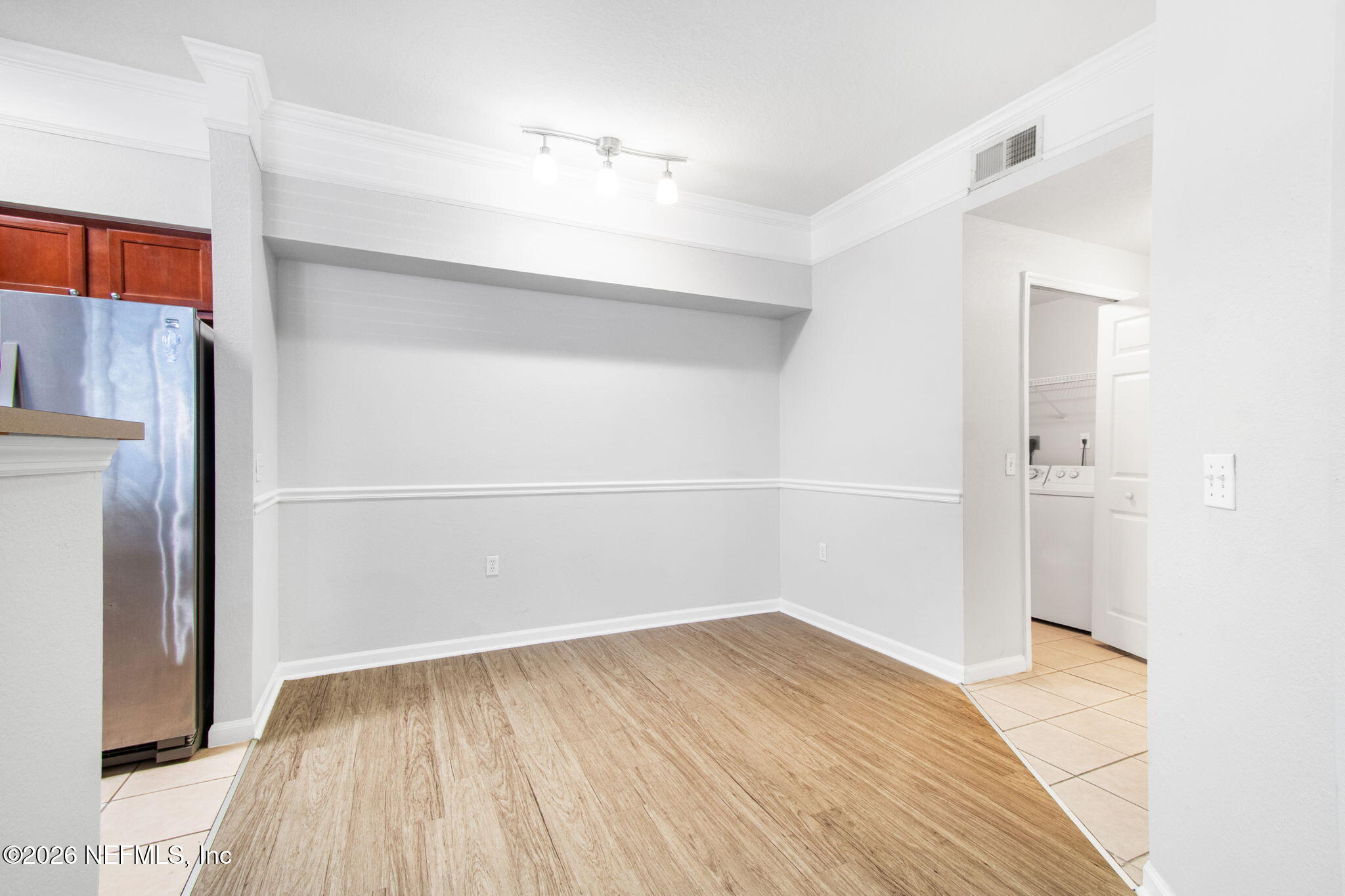 8550 Touchton Road, Unit 511 Jacksonville, FL 32216 - Photo 24 of 63 a view of empty room with wooden floor