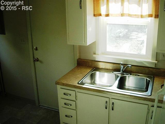 714 Prairie Road, Unit A & #B Colorado Springs, CO 80909 - Photo 12 of 22 Unit A Door to rear yard.