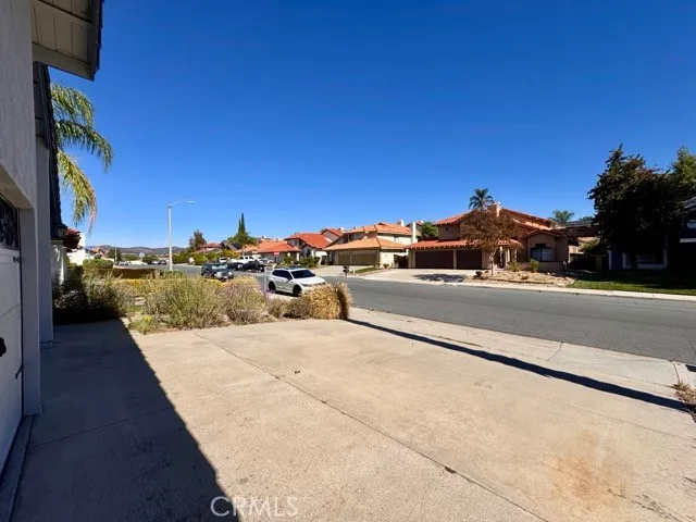 a view of car parked on the street side