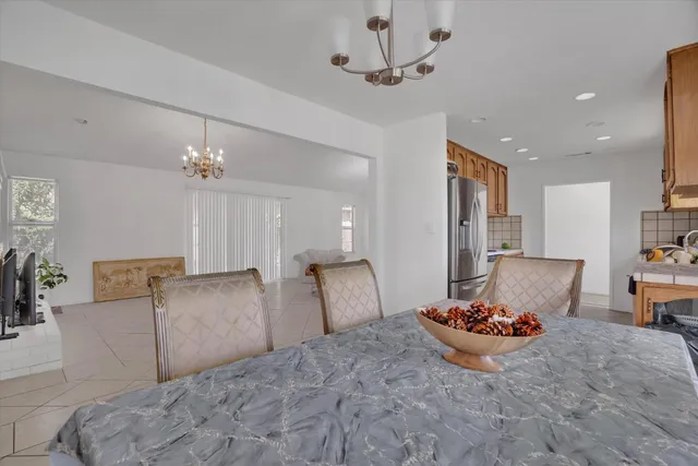 a view of a kitchen and dining room