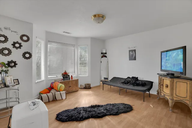 a bed room with furniture and a window